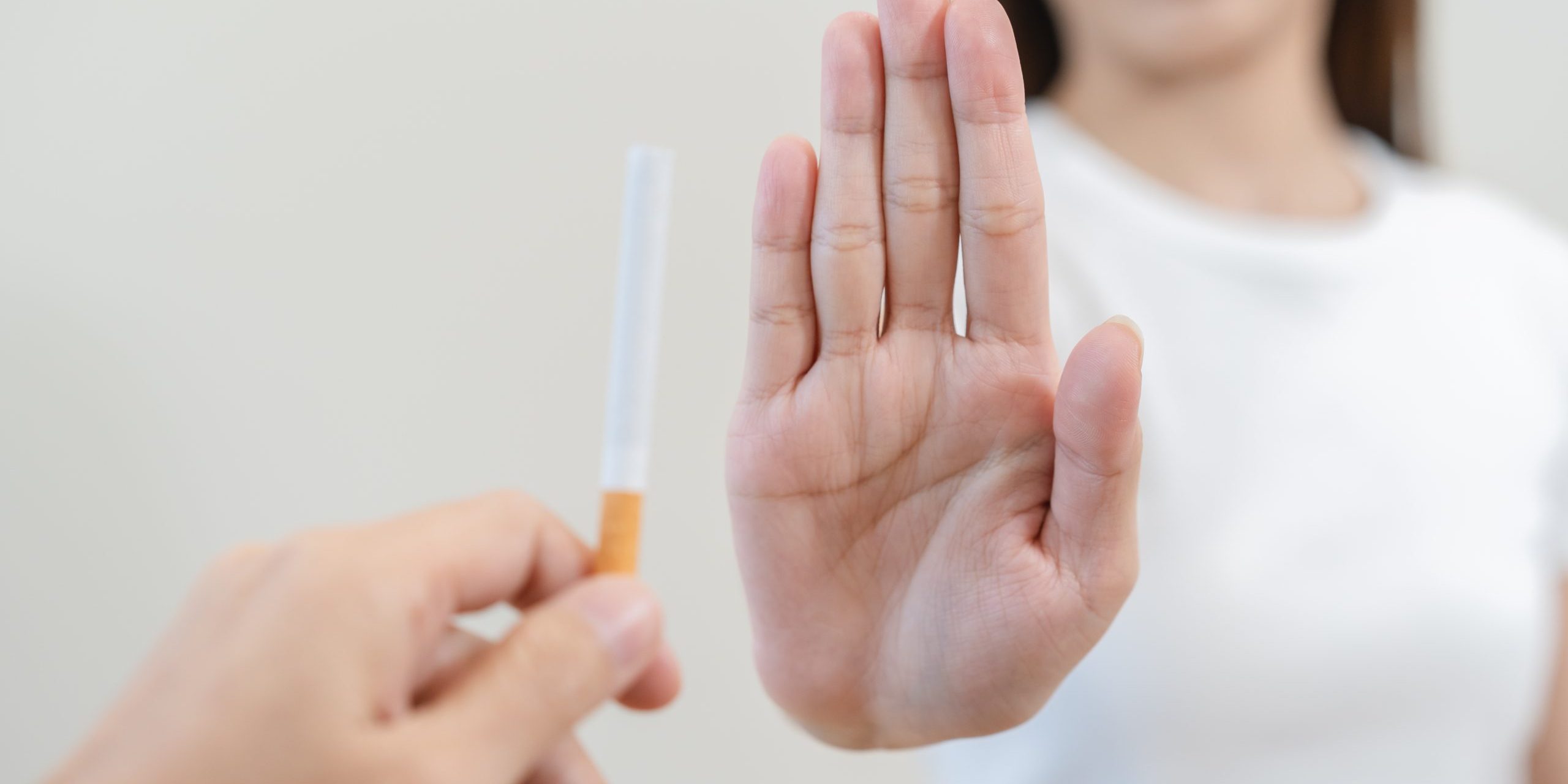 Close,Up,Hands,Of,Person,Refusing,To,Smoke,Cigarette.